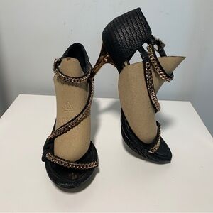 Black BCBGmaxazaria Priela stilettos with gold chain on strap - size 8